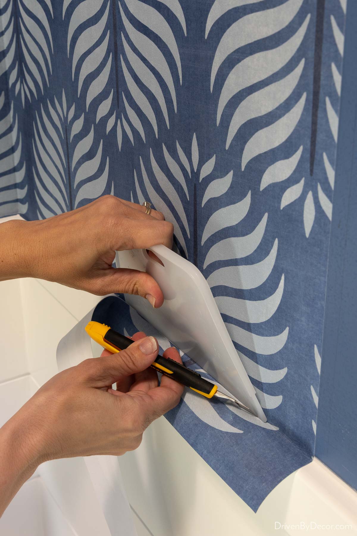 Professional wall preparation for wallpaper installation